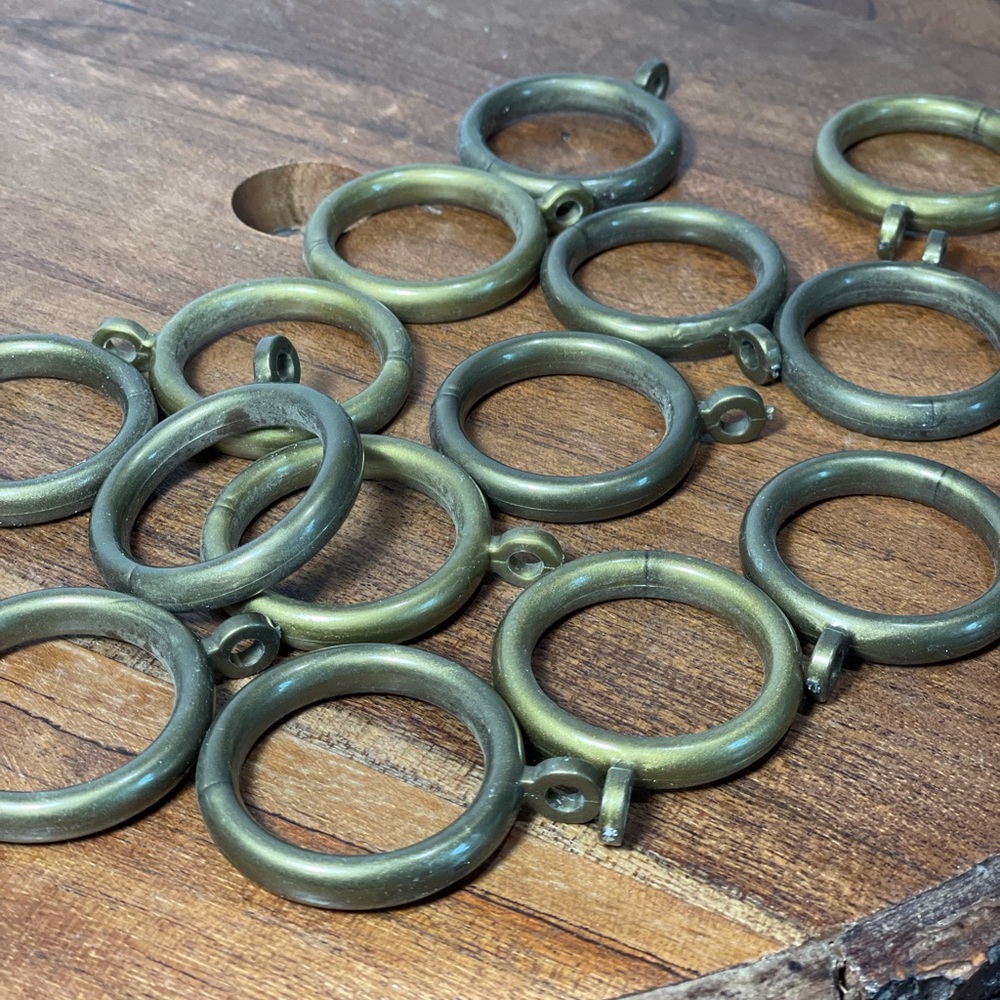 Antique brass look shower curtain rings